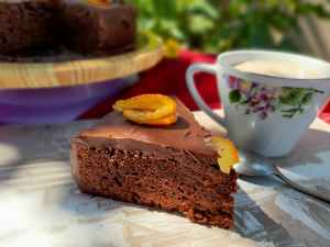 Slice Of Cake And Cup Of Tea In A Fine China Mug In The Sun