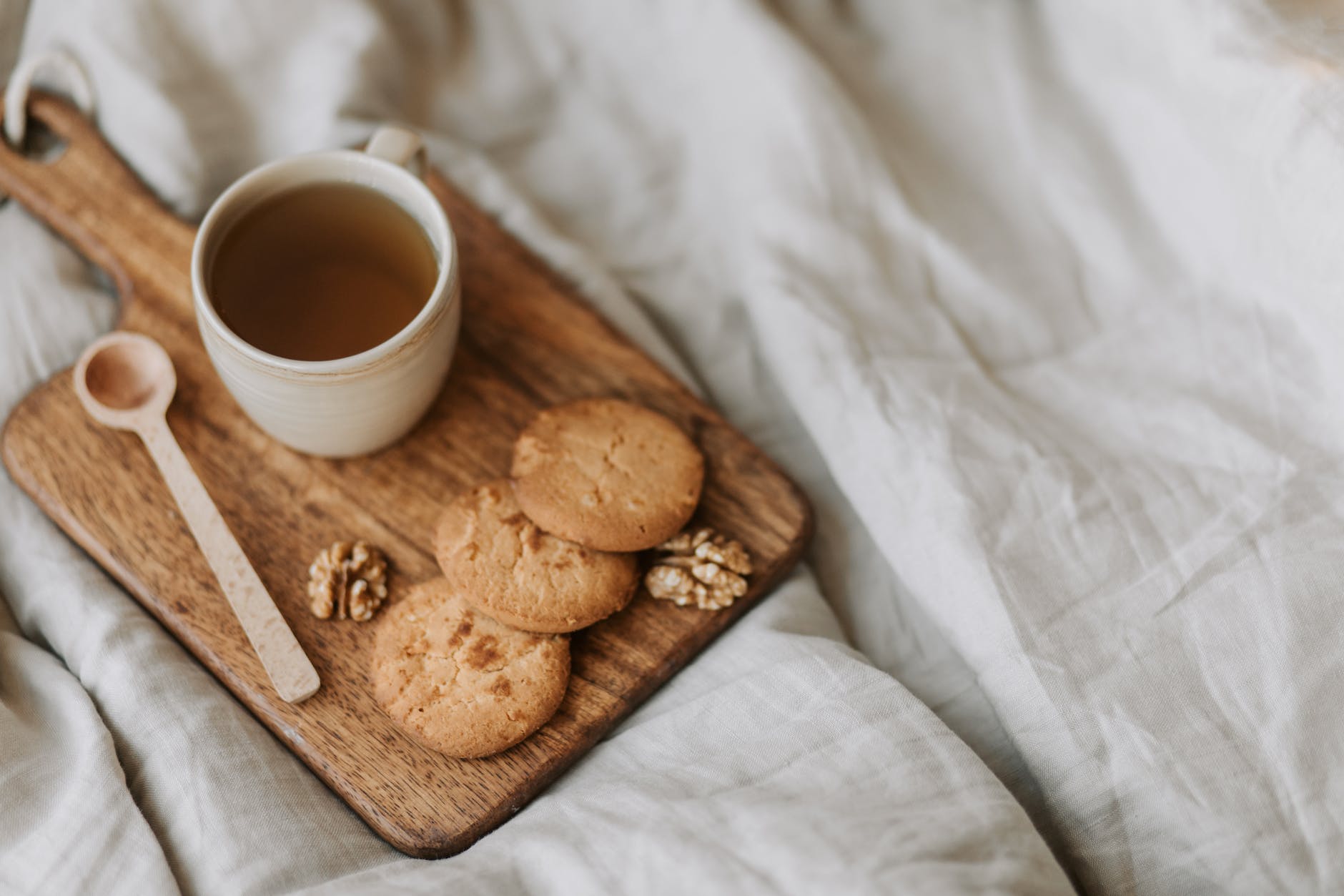 Tea And Biscuits On A Wooden Board