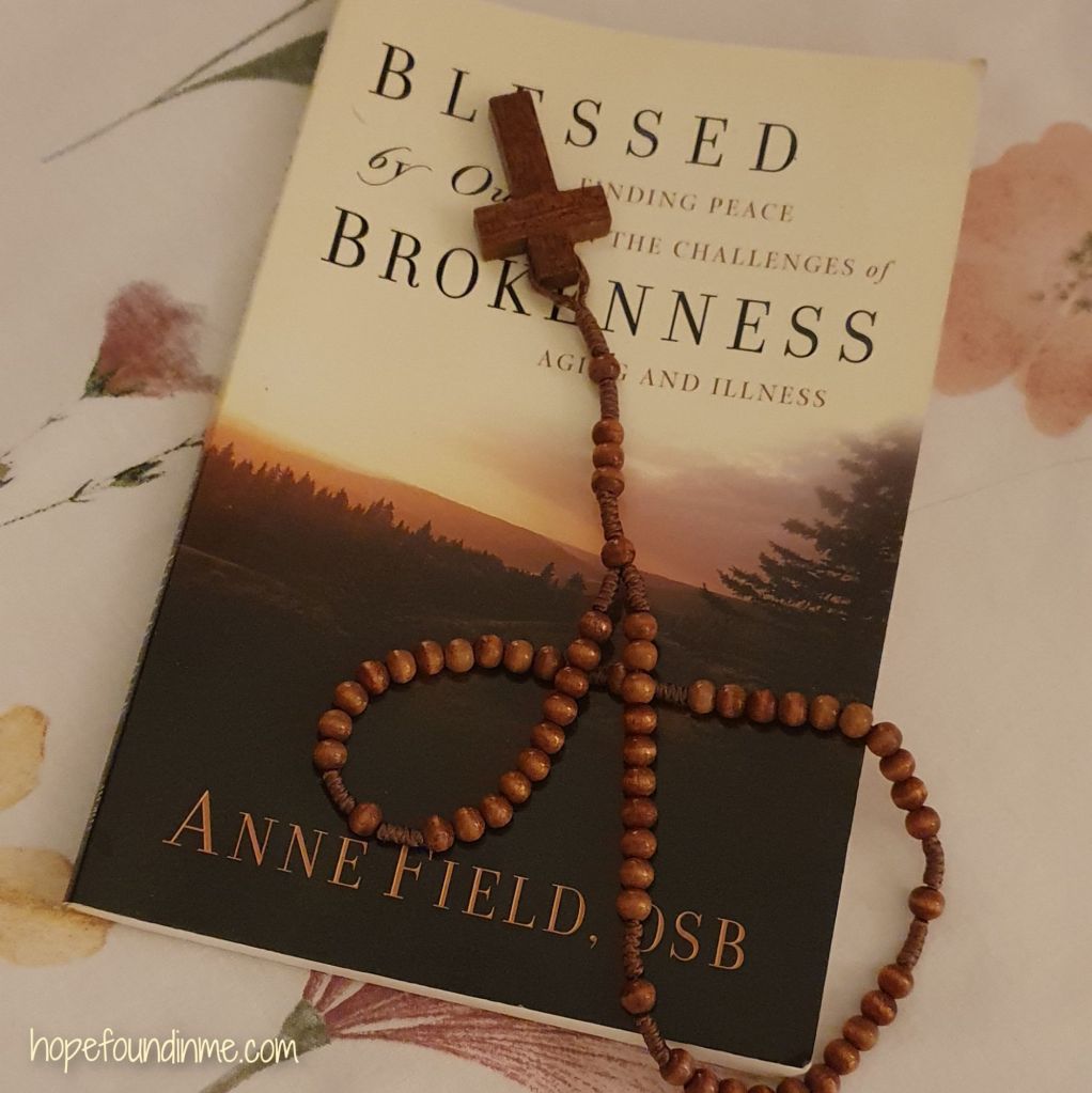 The Book 'Blessed by our Brokenness' by Anne Field OSB pictured with my Rosary