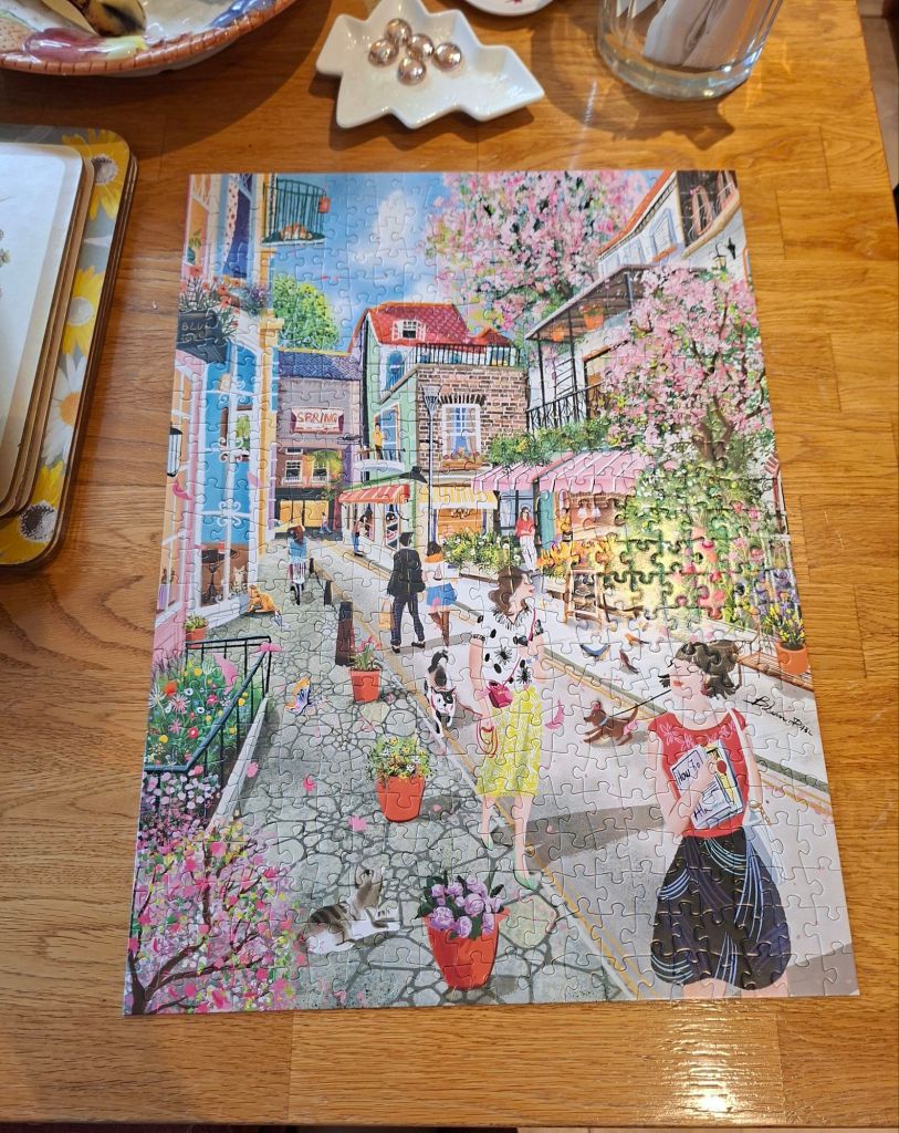 A jigsaw puzzle of an allegorical spring street scene