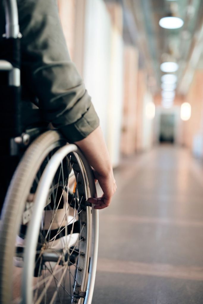 Wheelchair User in a long corridor